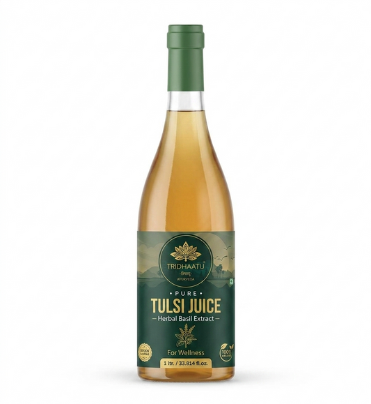 A bottle of Tridhaatu Ayurveda Pure Tulsi Juice 1L | Herbal Basil Extract for Immunity &amp; Wellness, featuring a dark green label and a matching green cap, filled with a golden-yellow liquid, set against a plain white background.