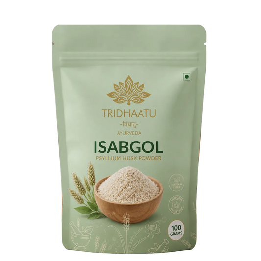 Green package of Tridhaatu Ayurveda Isabgol Psyllium Husk Powder with a wooden bowl of powder on a blurred kitchen background.