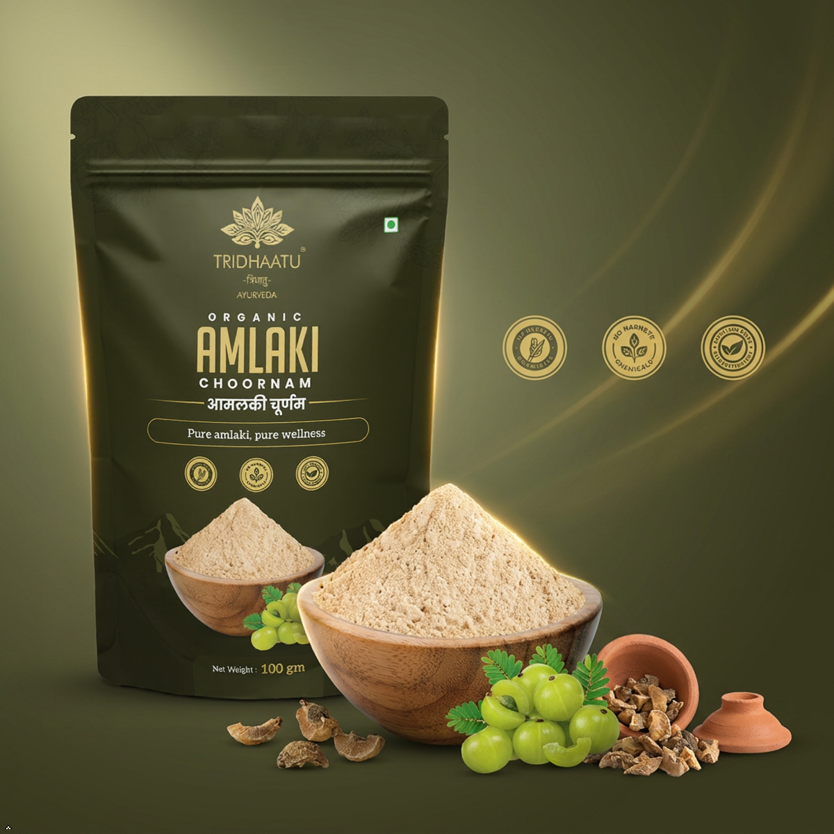 Tridhaatu Organic Amlaki Choornam packaging with a bowl of powder and ingredients on a green background