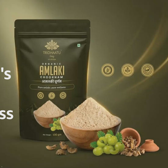 Tribhuvan Organic Amlaki Chodiram packaging with amlaki fruits and powder on a wooden board.